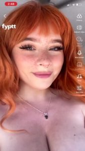 Redhead shows her sexy big bouncy Tik tits with big areolas