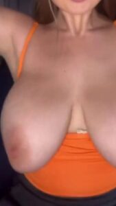 This girls top pulled down to reveal her big and bouncy breasts